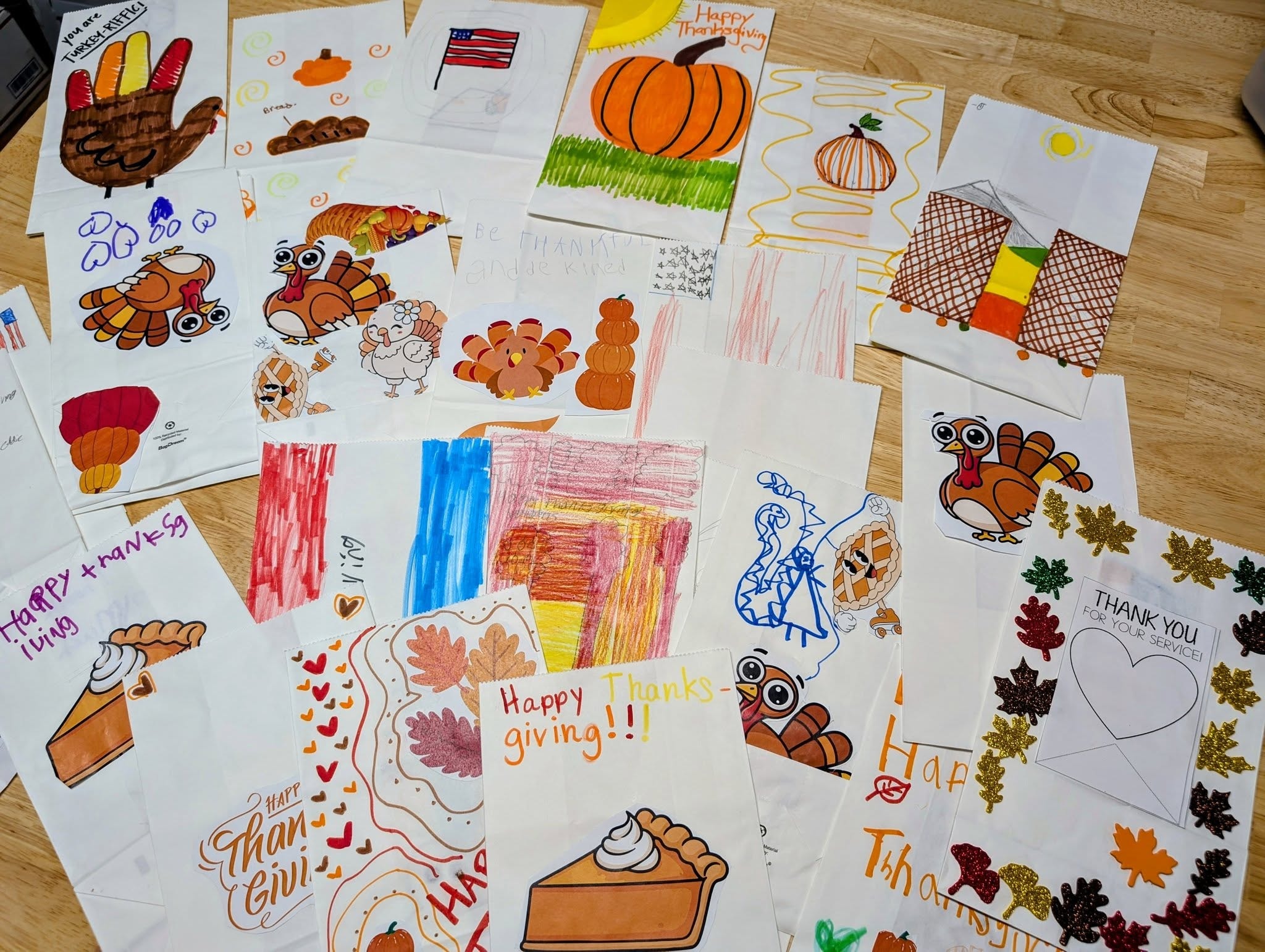 Thanksgiving drawings spread on the floor